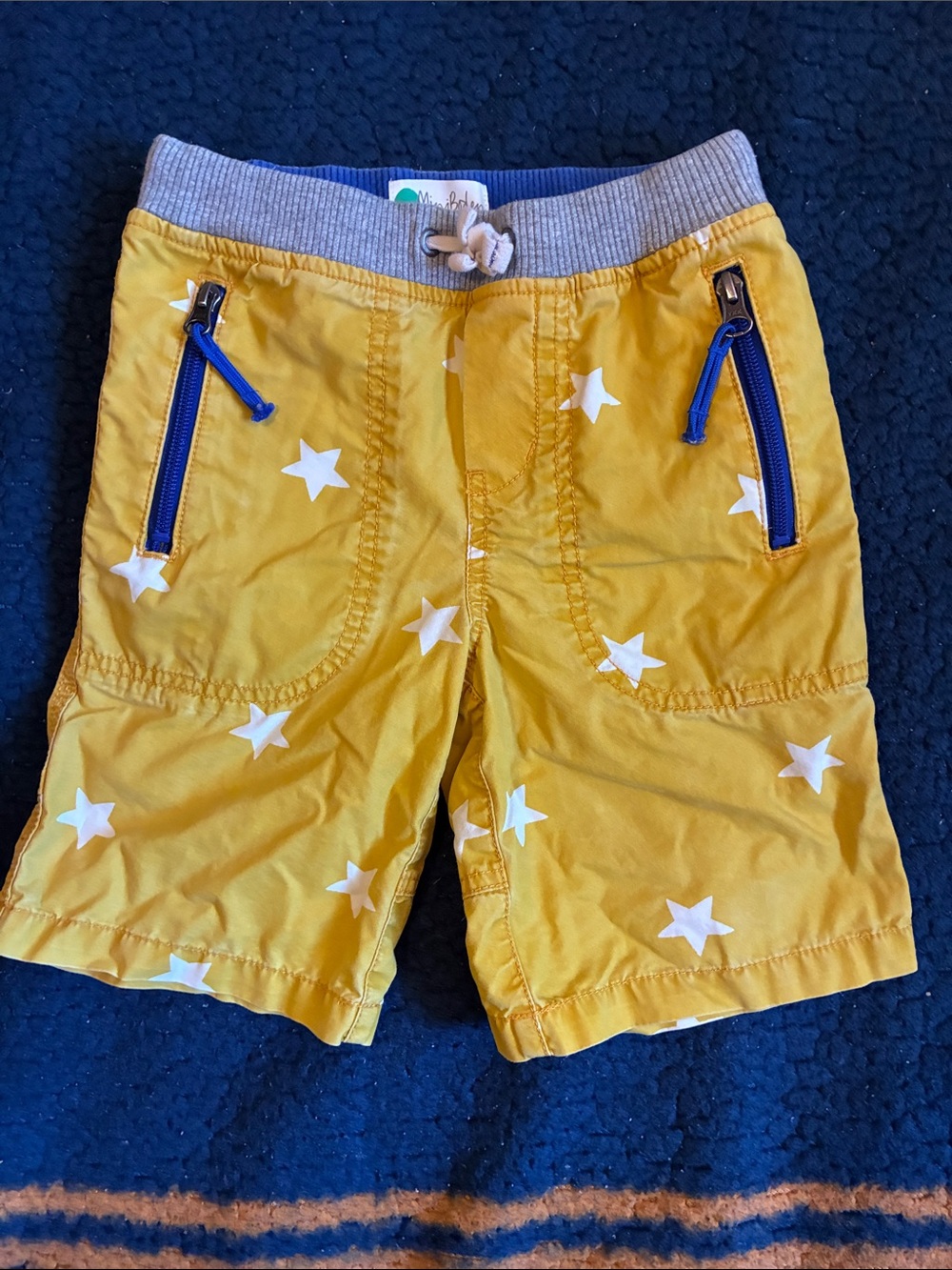 Mini Boden Yellow Star-Print Pull-On Shorts with Blue Zip Accents